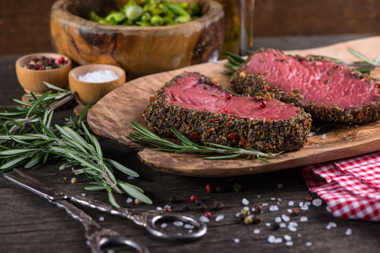 Use just salt, pepper, rosemary and lemon to season these pan-fried tenderloin steaks, to keep the flavor of the meat prominent.